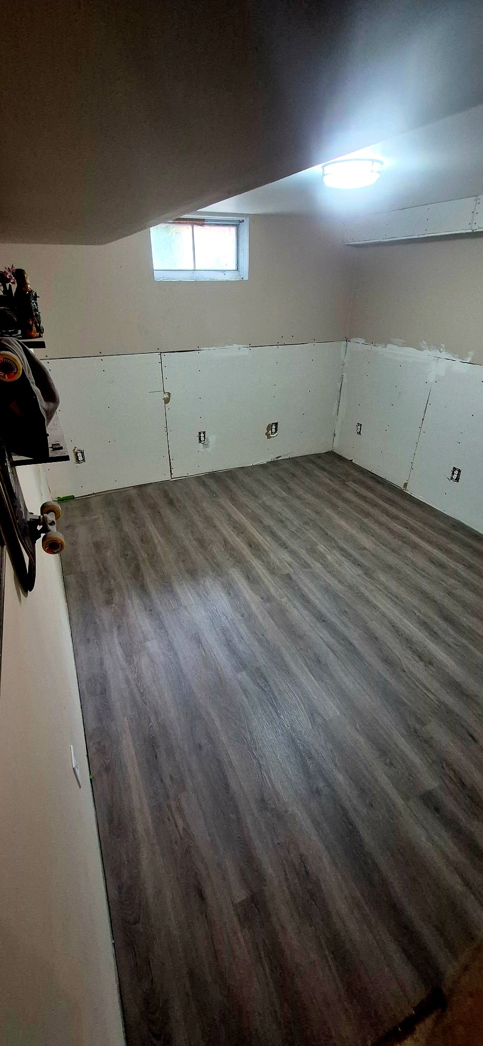 Newly installed wood-look plank flooring in a renovated room